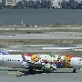 Southwest Airlines  - Boeing 737-7H4 (WL) - N945WN "Florida One" special colours<br />SFO - Airtrain - 14.5.2022 - 3:11 PM